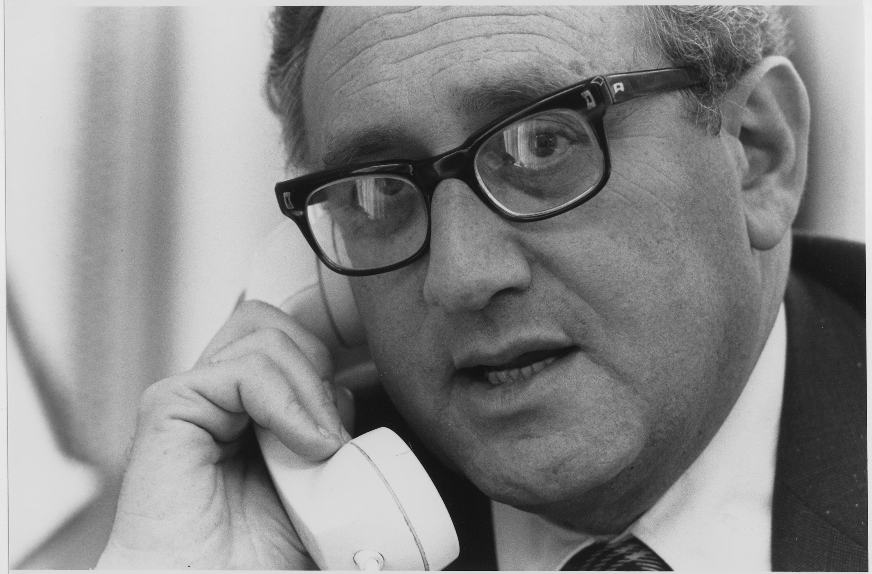 Photograph of Secretary of State Henry A. Kissinger Using the Telephone in Deputy National Security Advisor Brent Scowcroft’s Office to Get the Latest Information on the Situation in South Vietnam