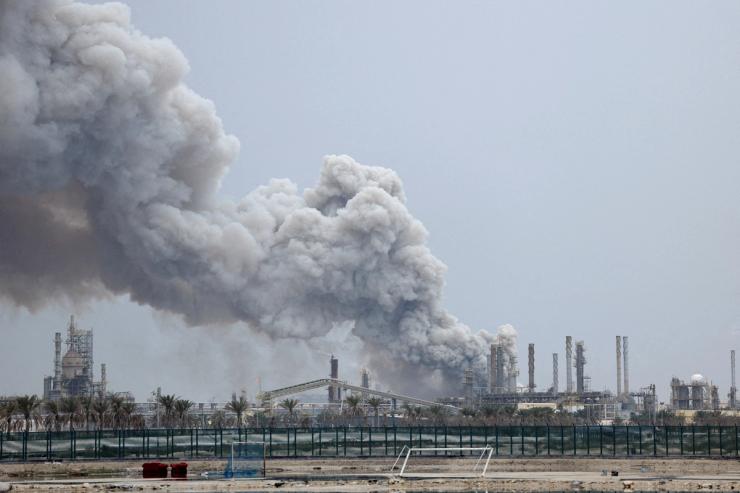 Smoke rises following a strike in Sitra Island.