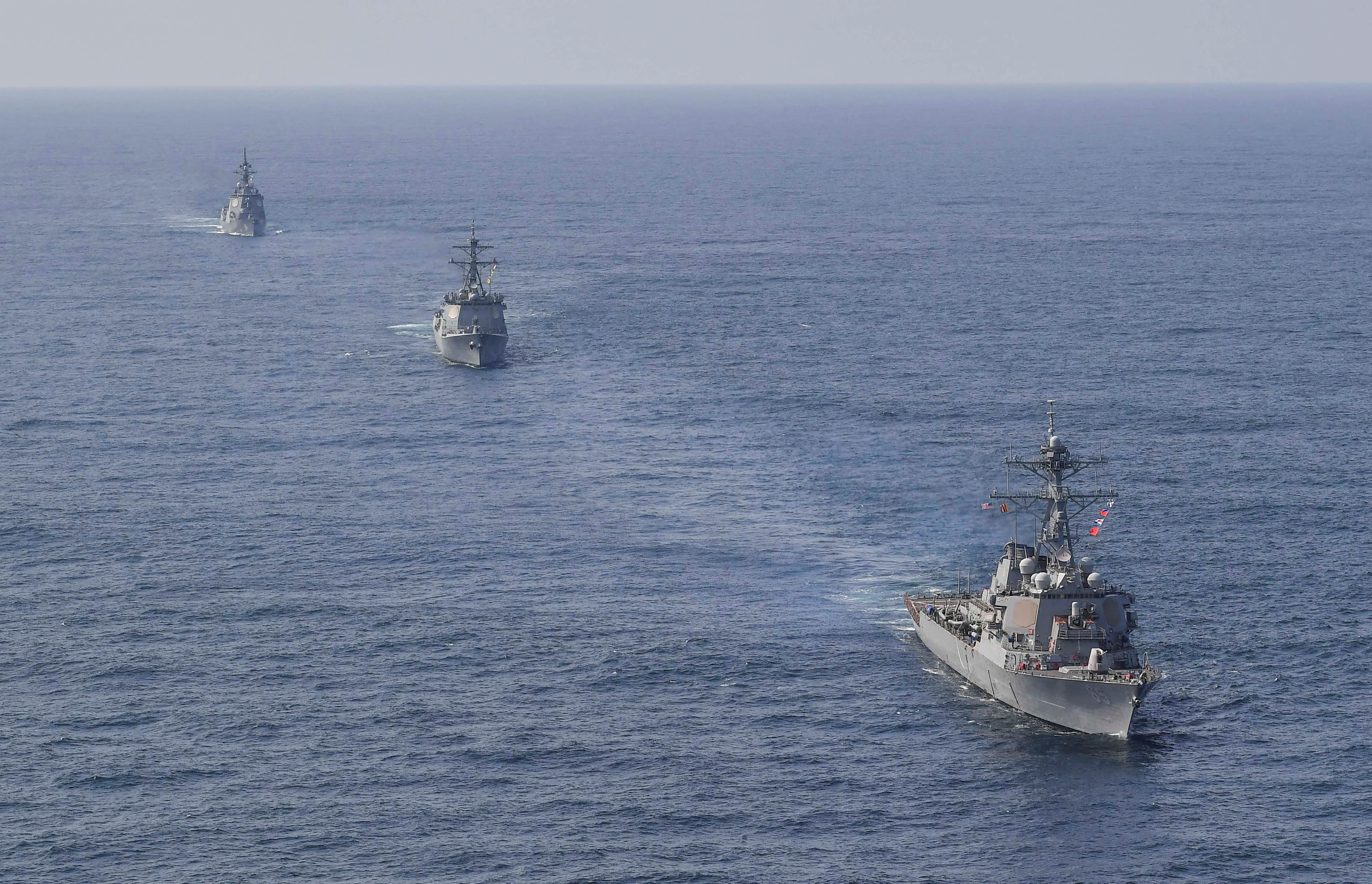 South Korean Navy’s destroyer Yulgok Yi I, the US Navy’s destroyer USS Benfold and Japan Maritime Self-Defense Force’s destroyer Atago take part in joint naval missile defense exercises in international waters between Korea and Japan
