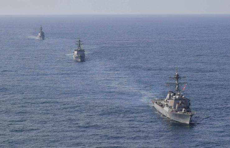 South Korean Navy’s destroyer Yulgok Yi I, the US Navy’s destroyer USS Benfold and Japan Maritime Self-Defense Force’s destroyer Atago take part in joint naval missile defense exercises in international waters between Korea and Japan