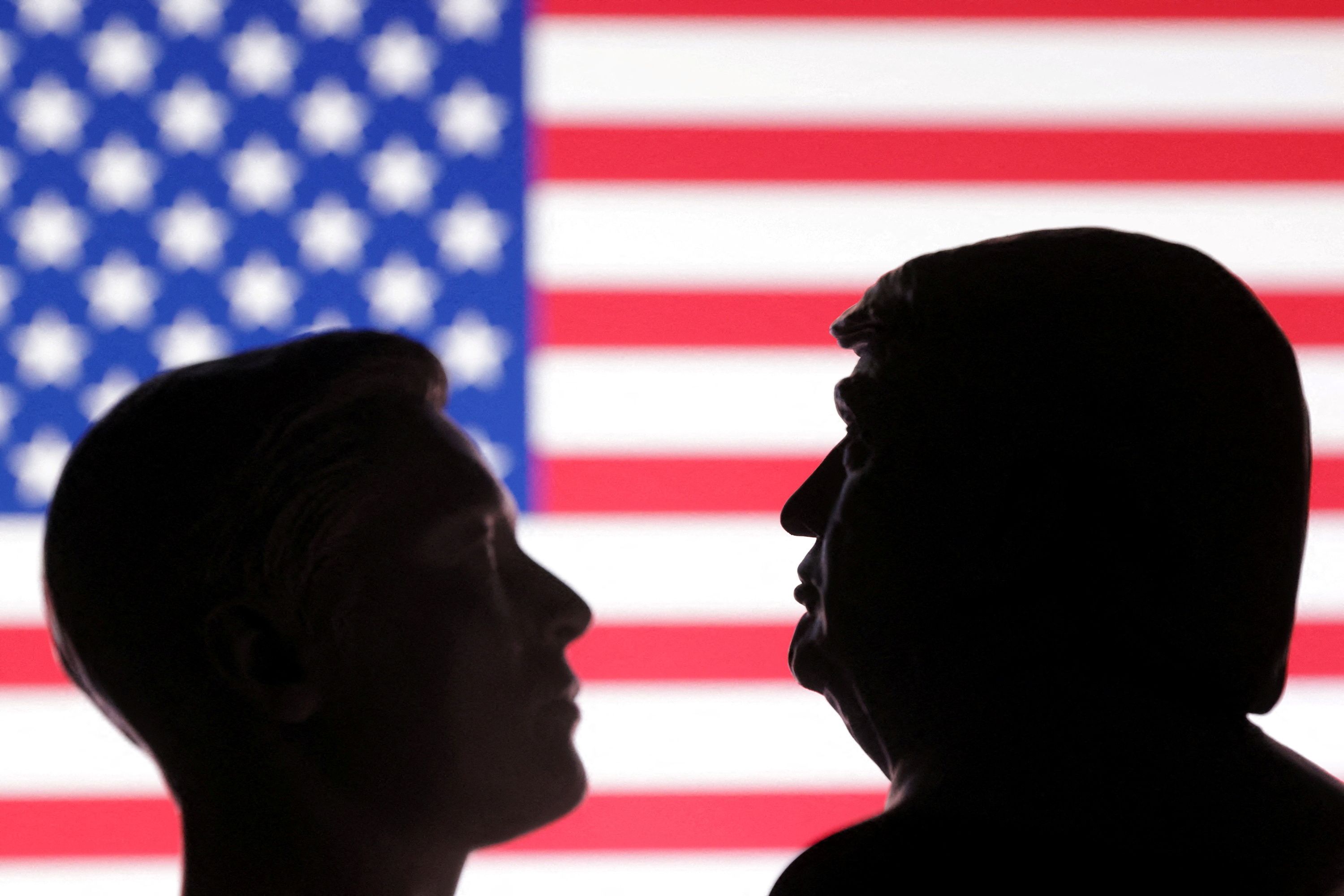 US flag, 3D printed miniatures of U.S. President Donald Trump and Elon Musk.