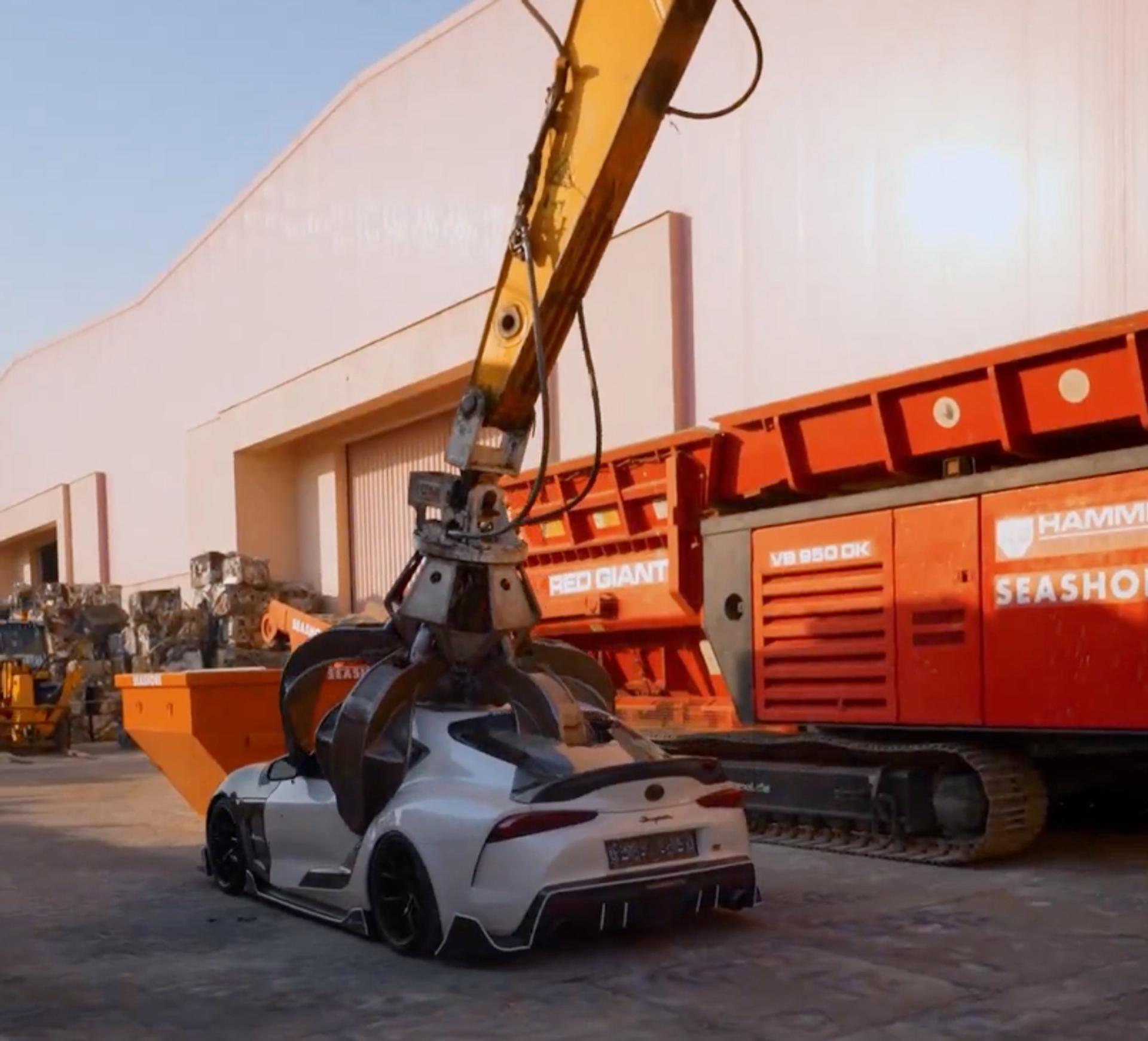 Screengrab of a video posted on X by Qatar’s Ministry of Interior of a car being crushed.