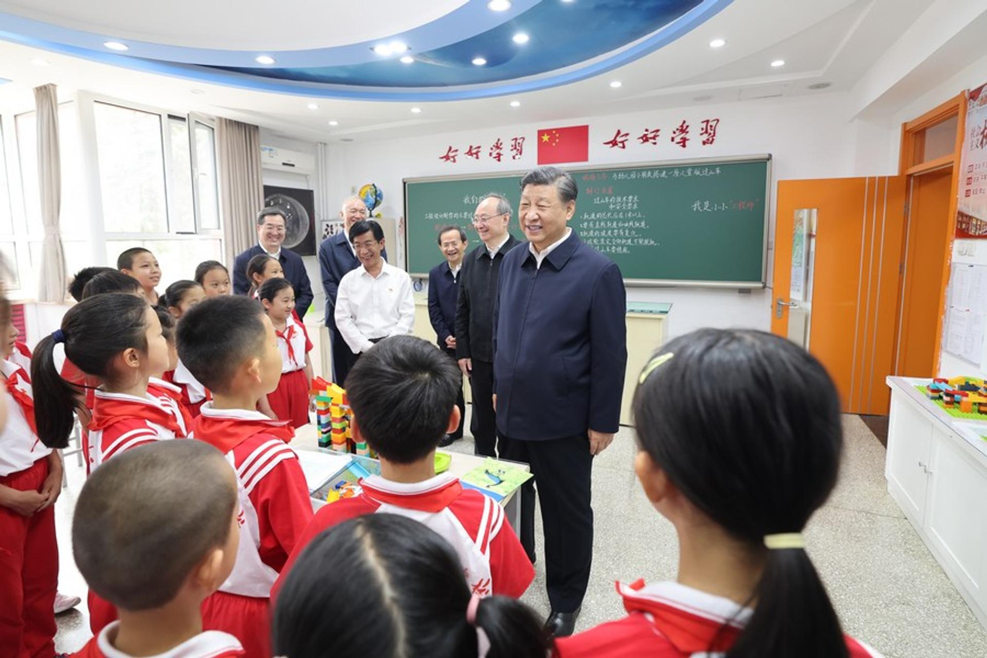 Xi Jinping visiting a school in China.