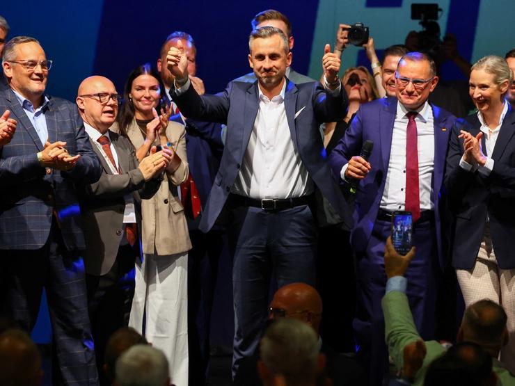 Top candidate of the far-right Alternative for Germany (AfD) Ulrich Siegmund gestures at the AfD election party