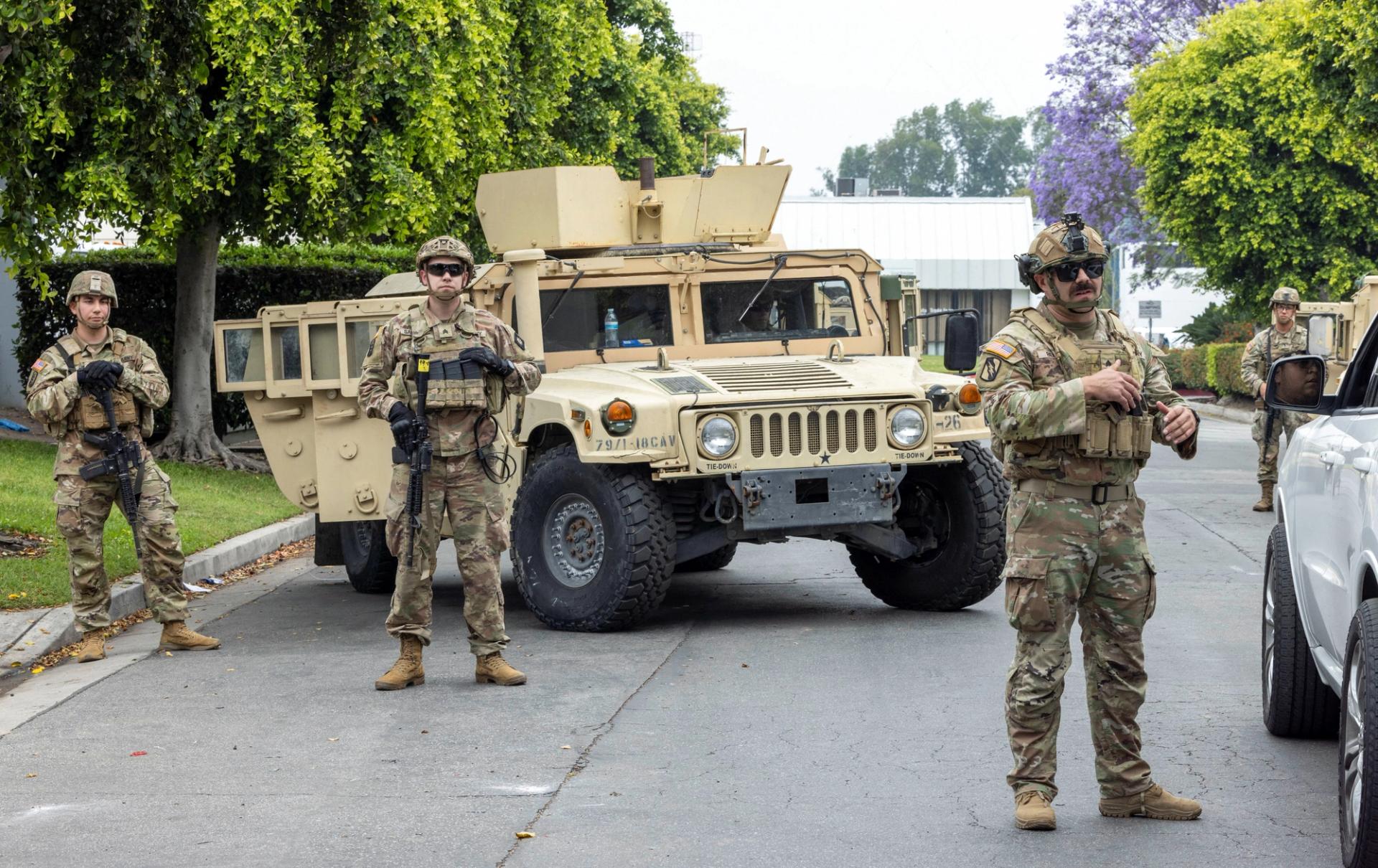 Members of the California National Guard stand guard in Los Angeles