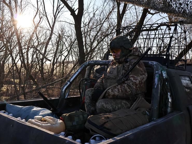 Ukrainian service member checks a shotgun in Zaporizhzhia region