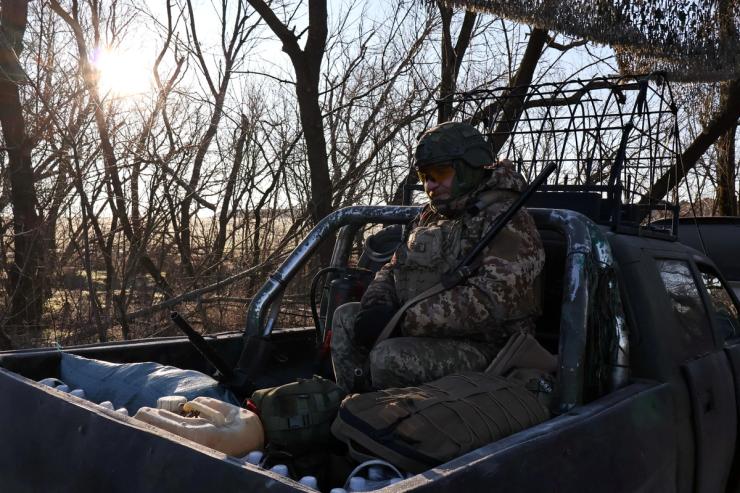 Ukrainian service member checks a shotgun in Zaporizhzhia region