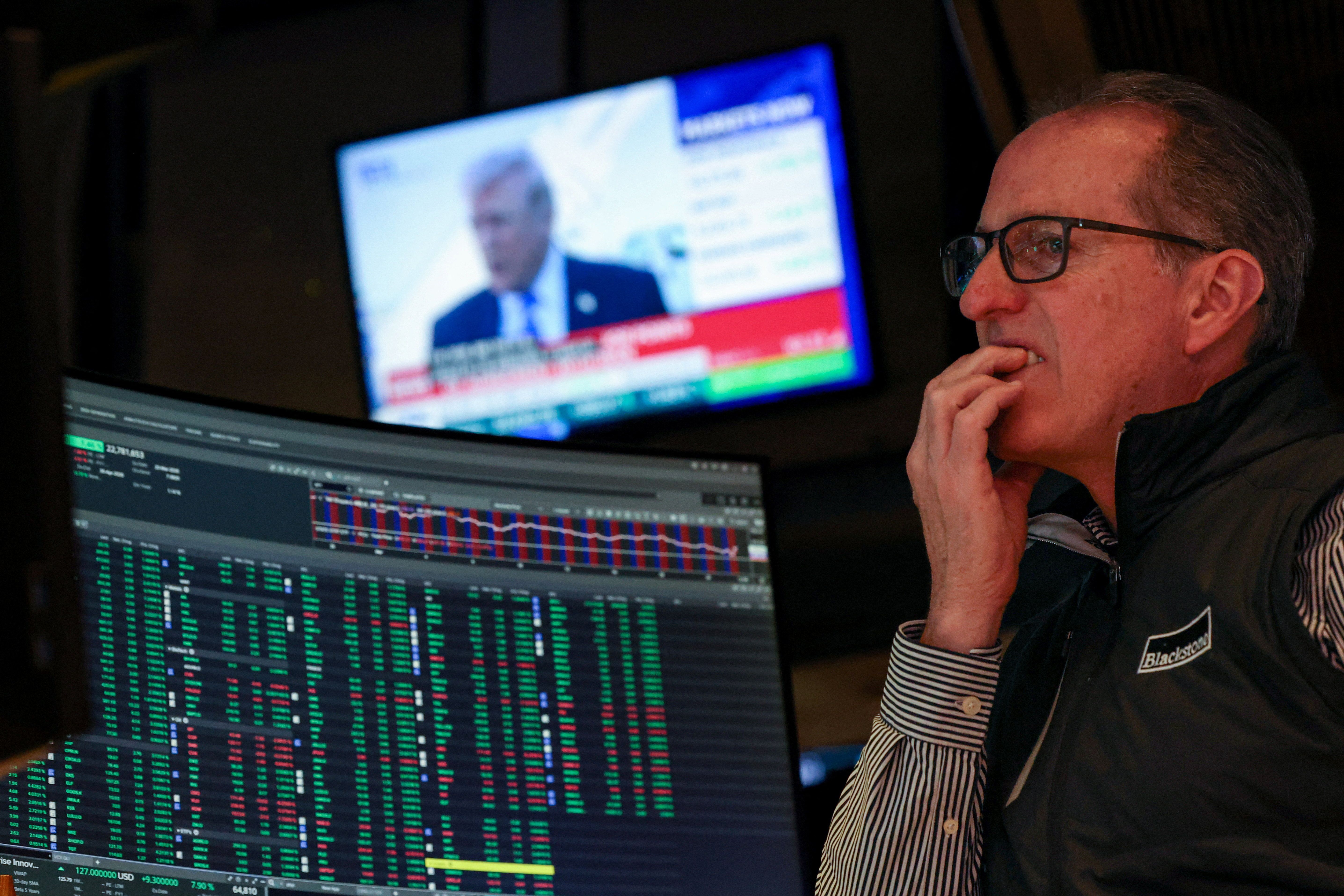A trader grimaces on the floor of the New York Stock Exchange