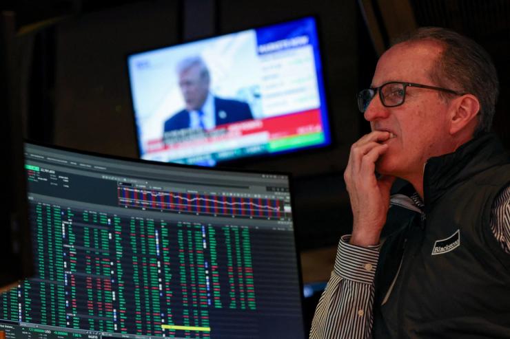 A trader grimaces on the floor of the New York Stock Exchange