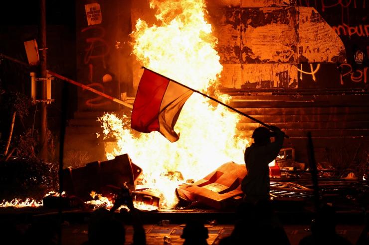 A protester carrying an Indonesian flag