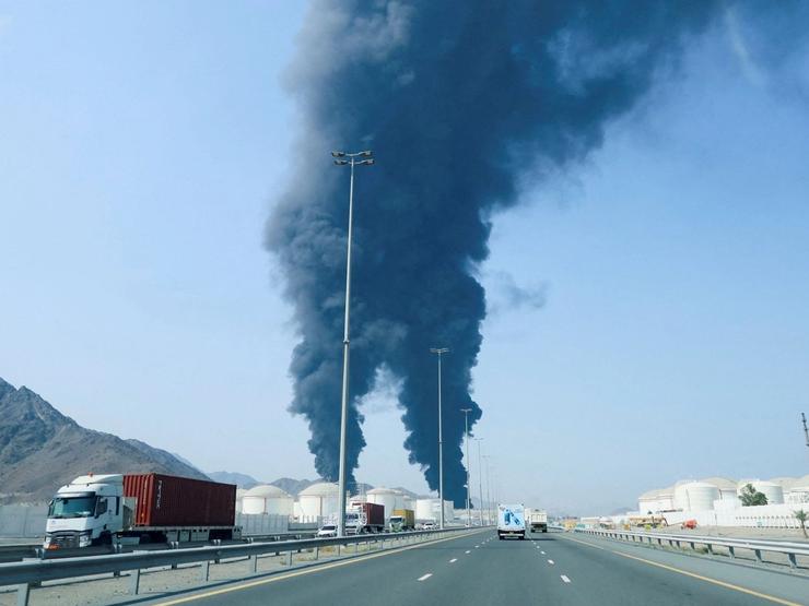 Smoke rises in the Fujairah oil industry zone, caused by debris after interception of a drone by air defenses