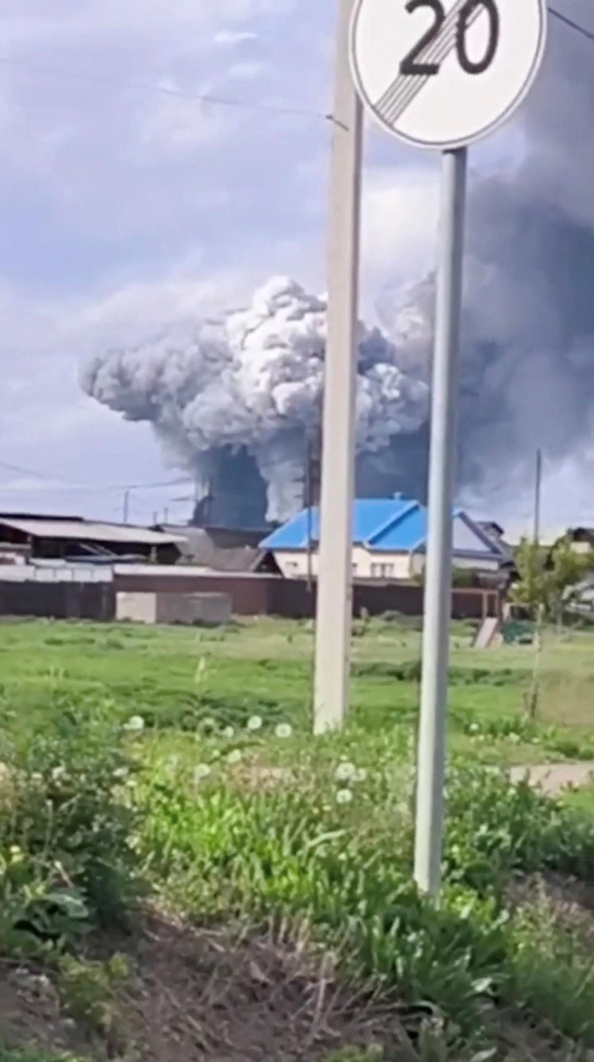 Smoke rises over Sredny in Russia’s Irkutsk region after a drone strike