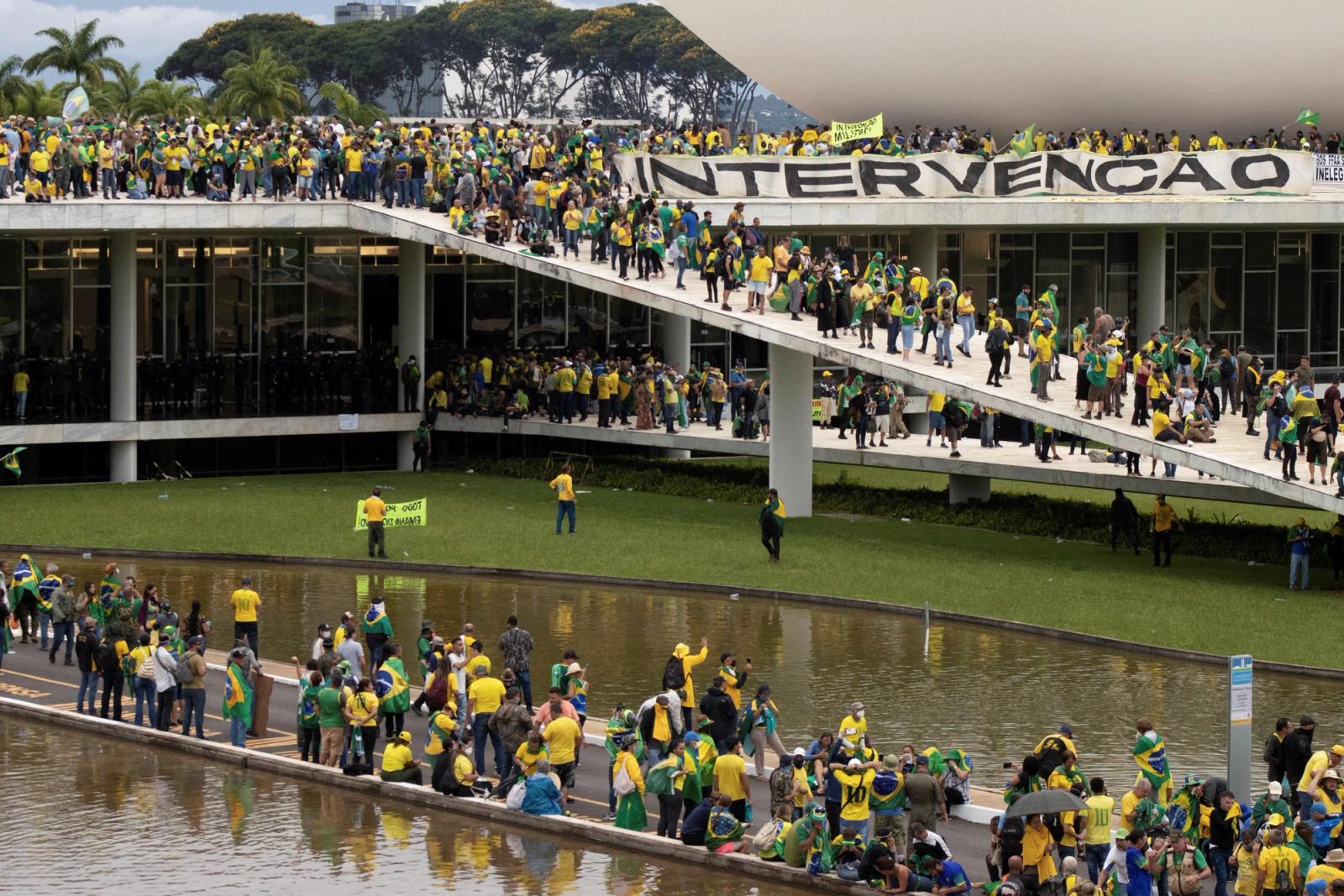 Supporters of Brazil's far-right former President Jair Bolsonaro who dispute the election of leftist President Luiz Inacio Lula da Silva gather at Planalto Palace after invading the building as well as the Congress and Supreme Court, in Brasilia, Brazil January 8, 2023.