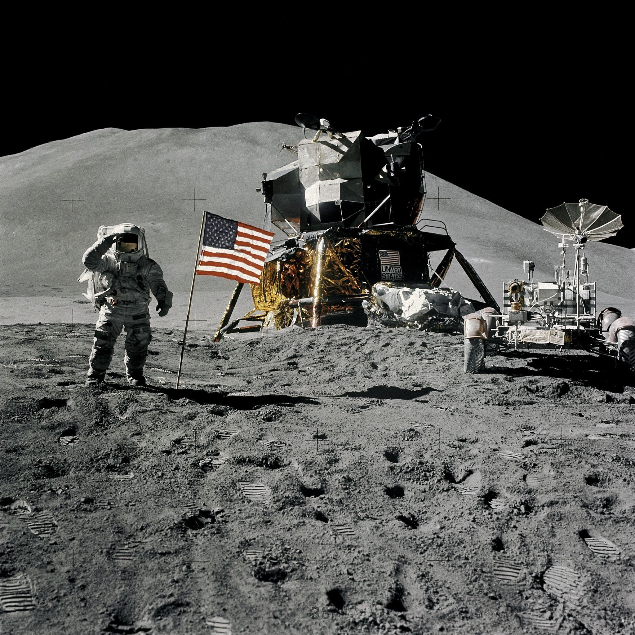 Astronaut poses with US flag during 1971 Moon mission.