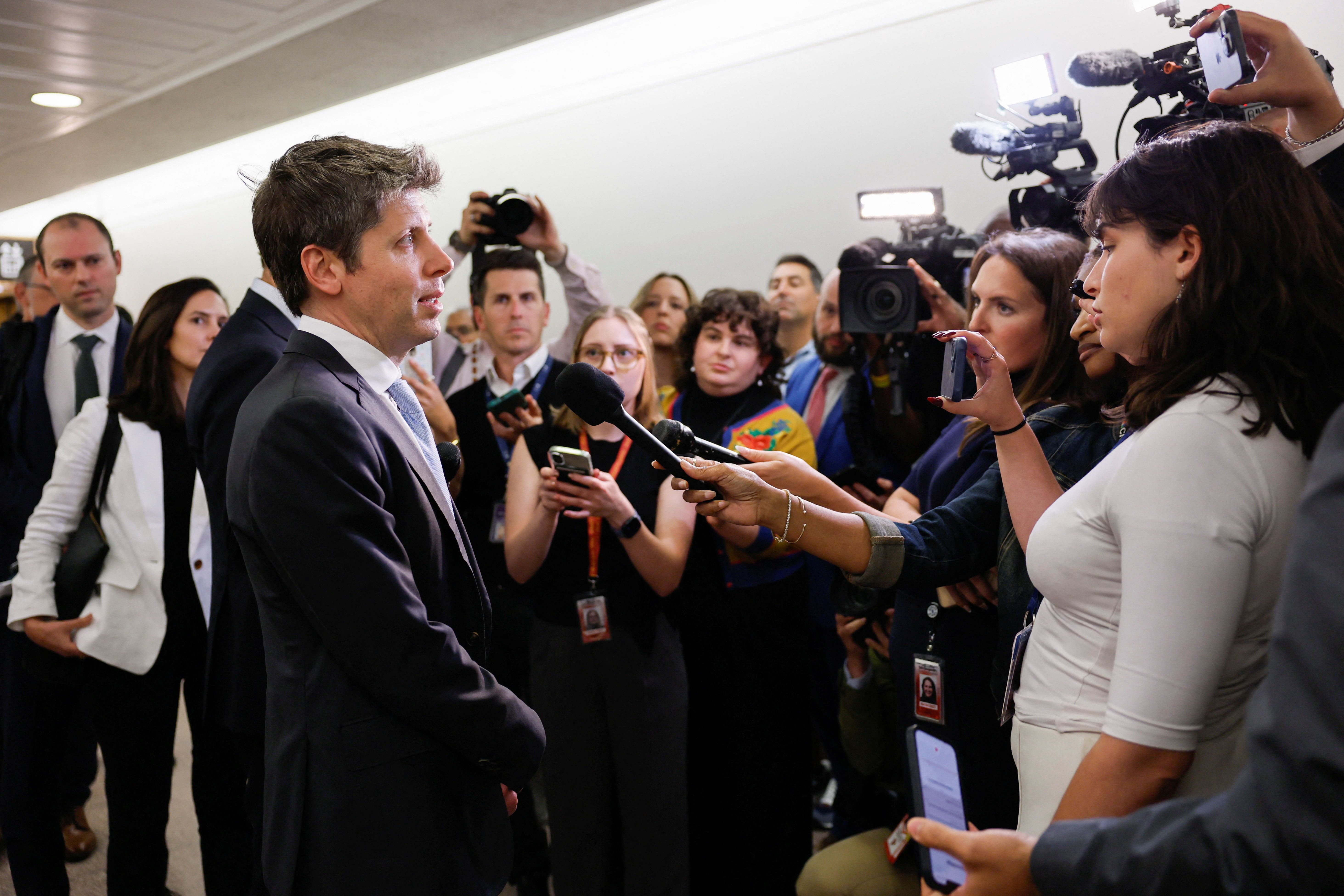 Sam Altman speaks with reporters following meetings on Capitol Hill
