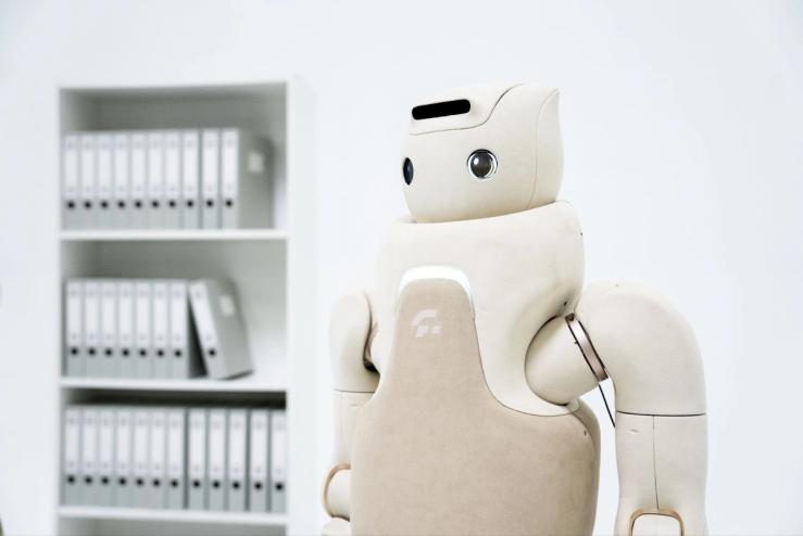 A humanoid robot in an office.