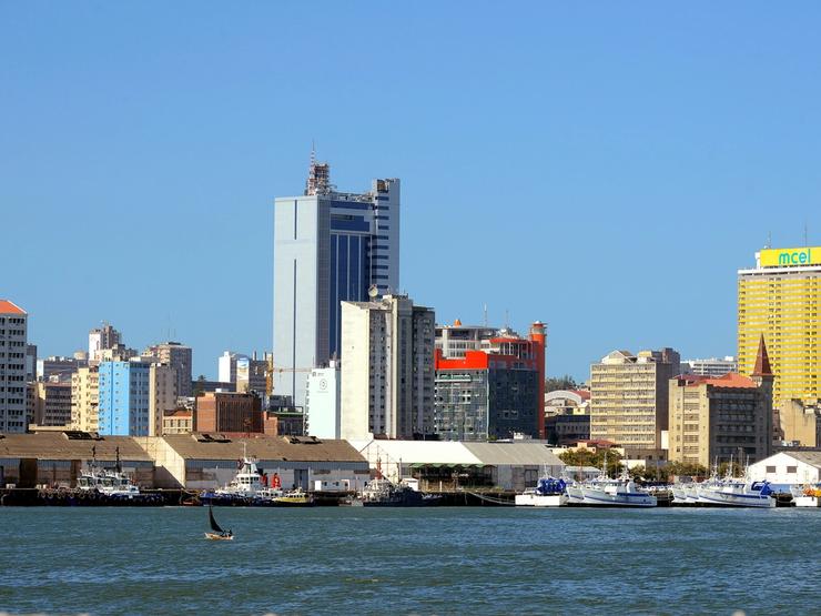 Fishing boats sit beneath the skyline of Mozambique’s capital Maputo.