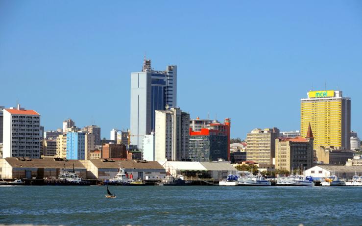Fishing boats sit beneath the skyline of Mozambique’s capital Maputo.