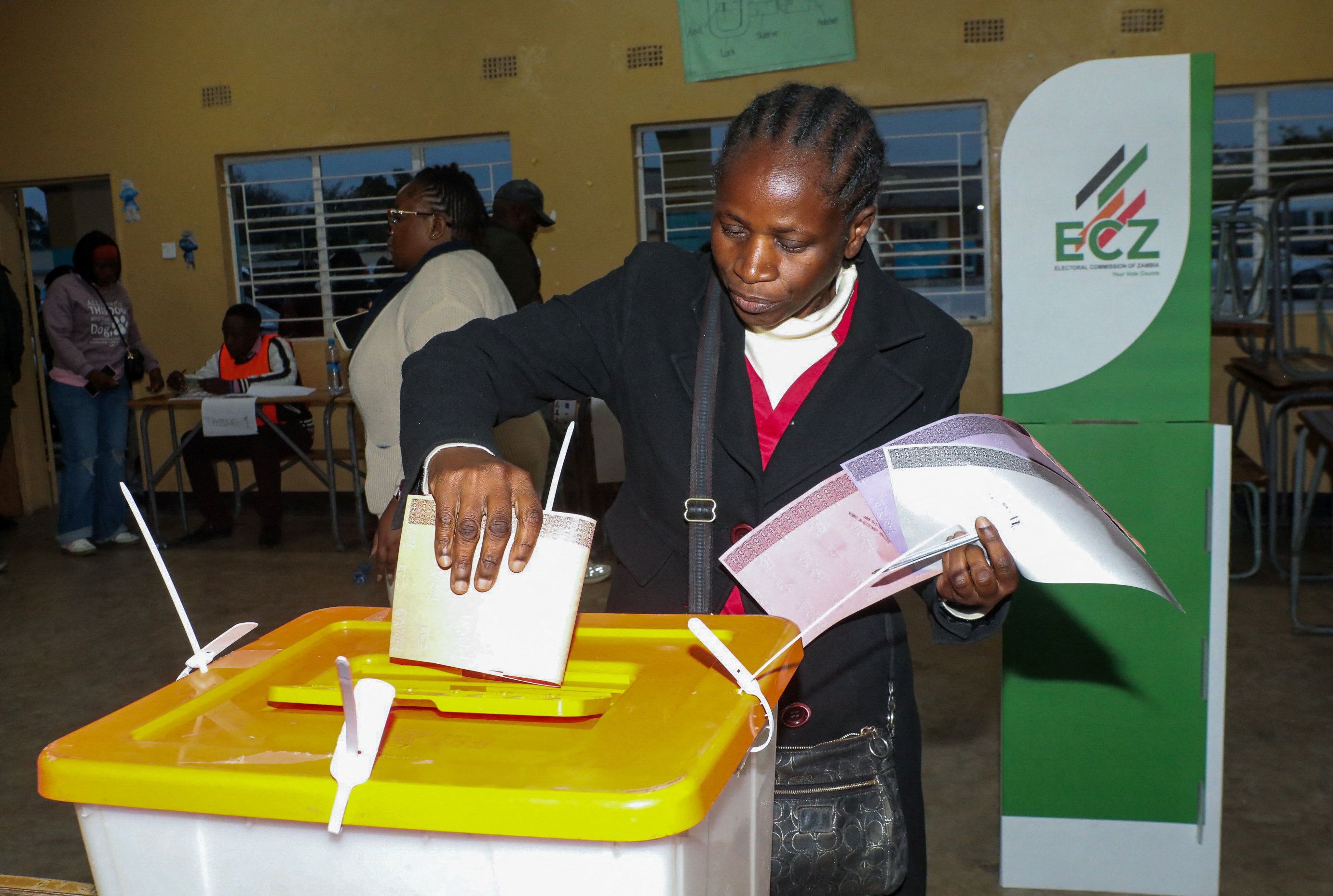 A person casts a vote at a polling station during Zambia’s general elections.