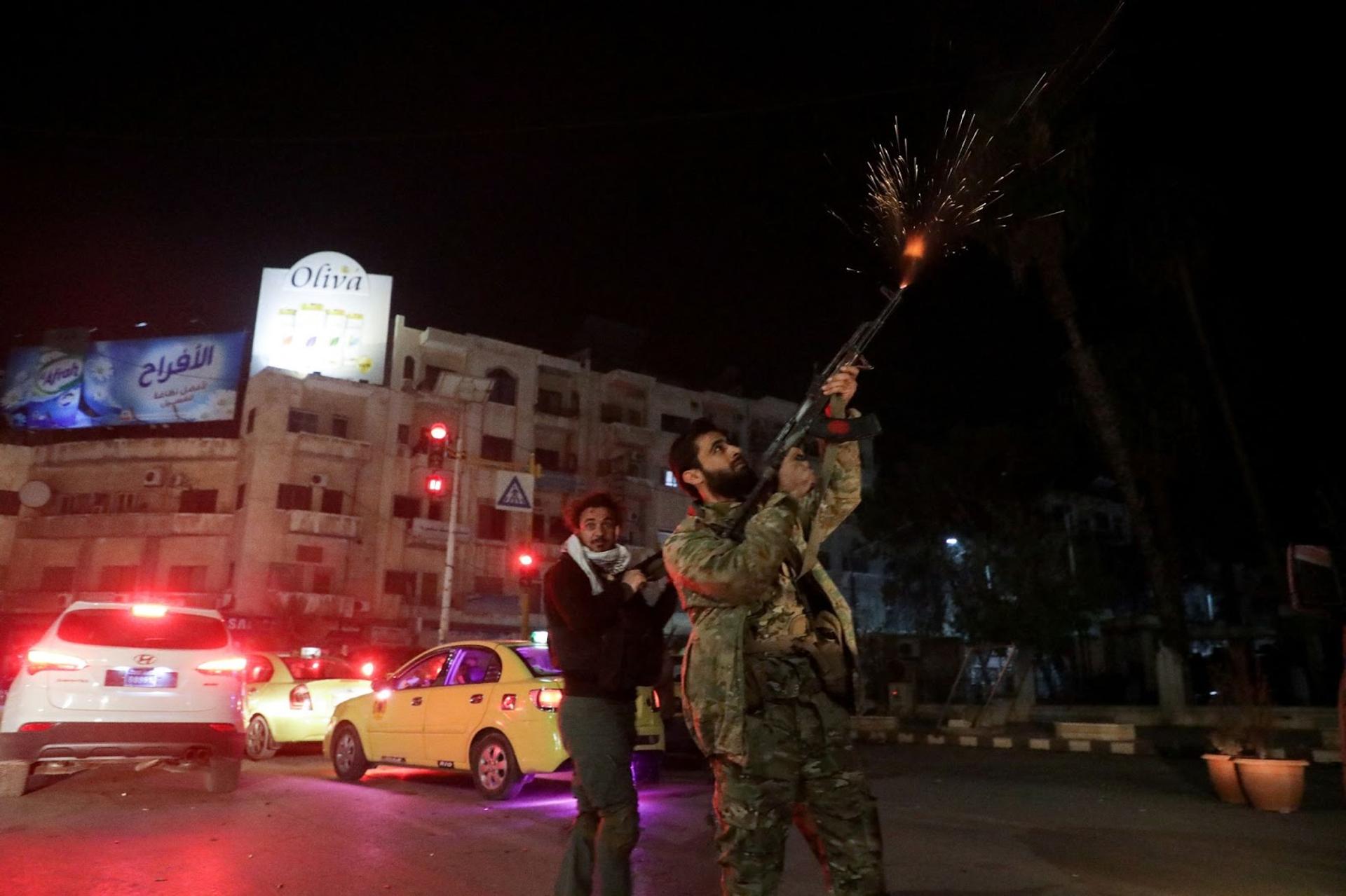 Syrian rebels celebrating the capture of Hama