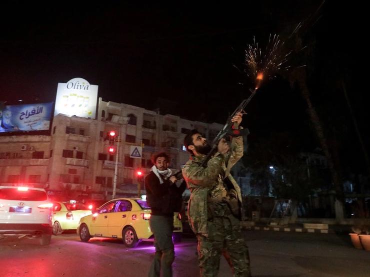 Syrian rebels celebrating the capture of Hama