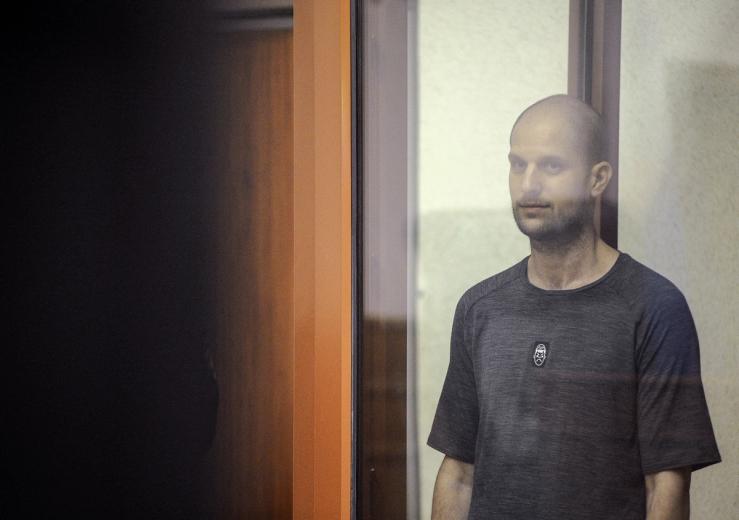 Evan Gershkovich stands inside an enclosure for defendants as he attends a court hearing in Yekaterinburg, Russia, on July 19, 2024.