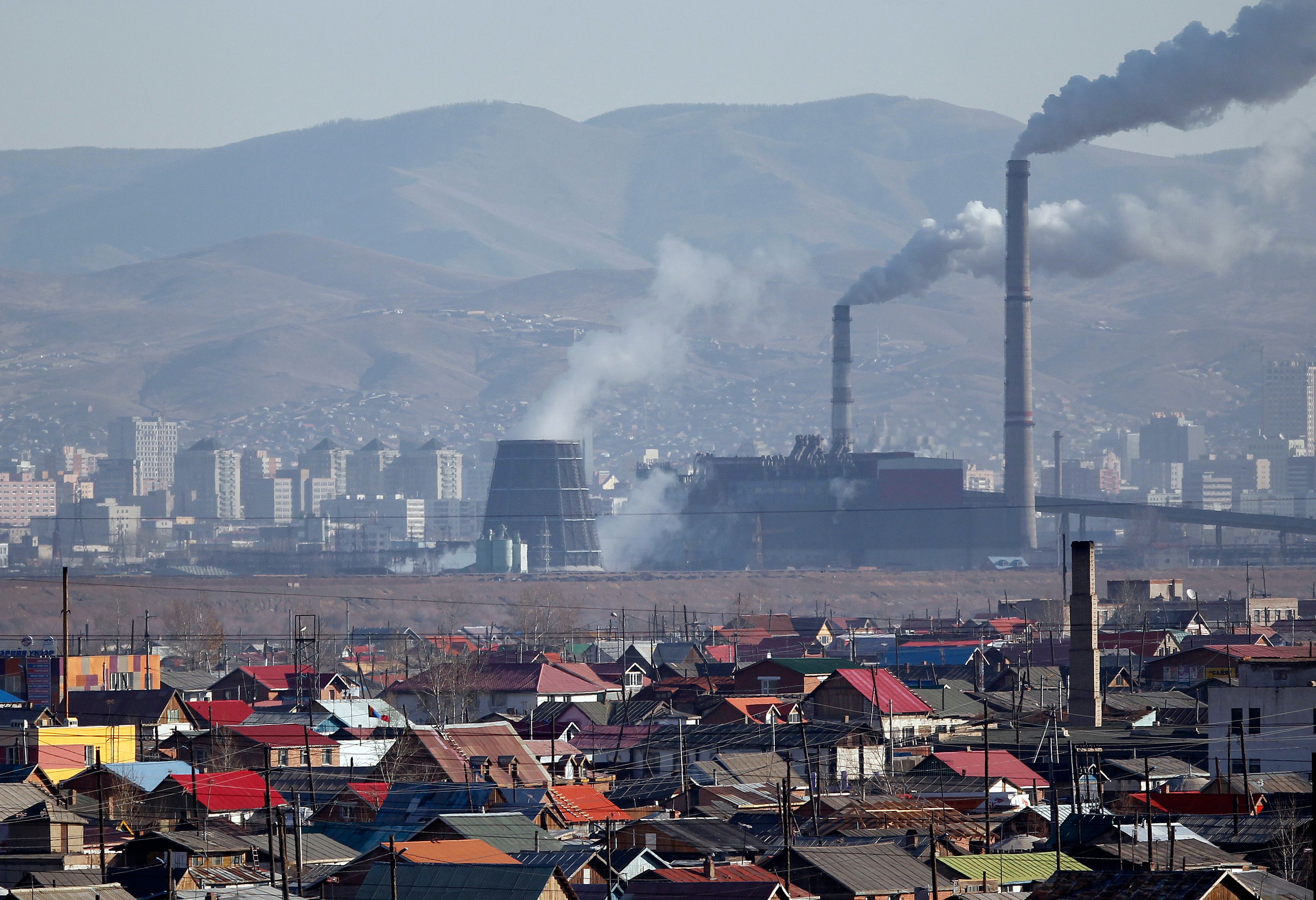 Smoke billows from the chimneys of a coal-burning power plant in Ulan Bator 