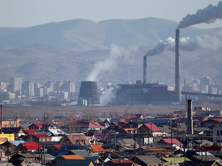 Smoke billows from the chimneys of a coal-burning power plant in Ulan Bator