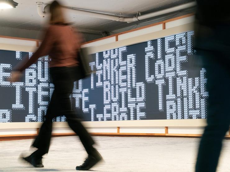 A person walks at Anthropic’s Code with Claude conference.