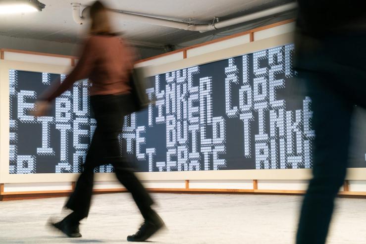 A person walks at Anthropic’s Code with Claude conference.