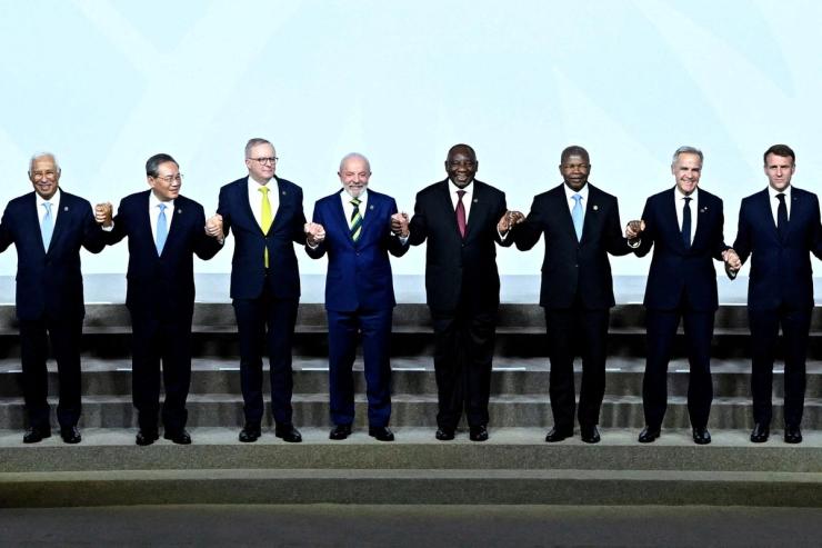 World Leaders including European Council President Antonio Costa, China’s Prime Minister Li Qiang, Australia’s Prime Minister Anthony Albanese, Brazil’s President Luiz Inacio Lula da Silva, South African President Cyril Ramaphosa, Angola’s President Joao Lourenco, Canadian Prime Minister Mark Carney, and France’s President Emmanuel Macron pose for a photograph.