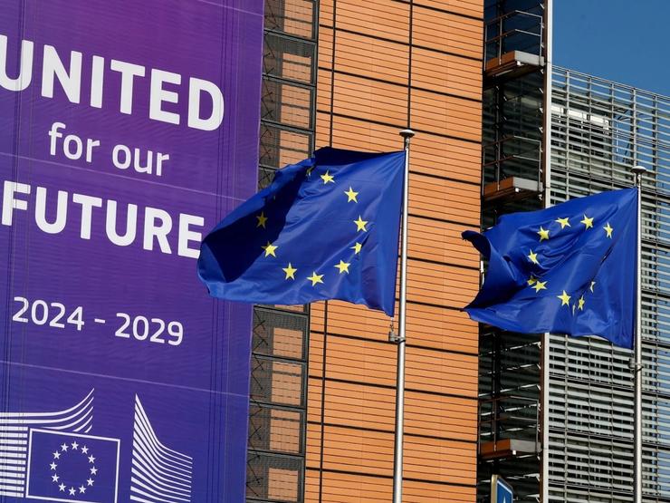 European Union flags flutter outside the European Commission headquarters in Brussels, Belgium April 9, 2025.