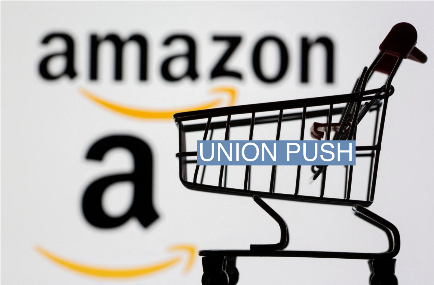 Small toy shopping cart is seen in front of displayed Amazon logo in this illustration taken, July 30, 2021. REUTERS/Dado Ruvic/Illustration/File Photo
