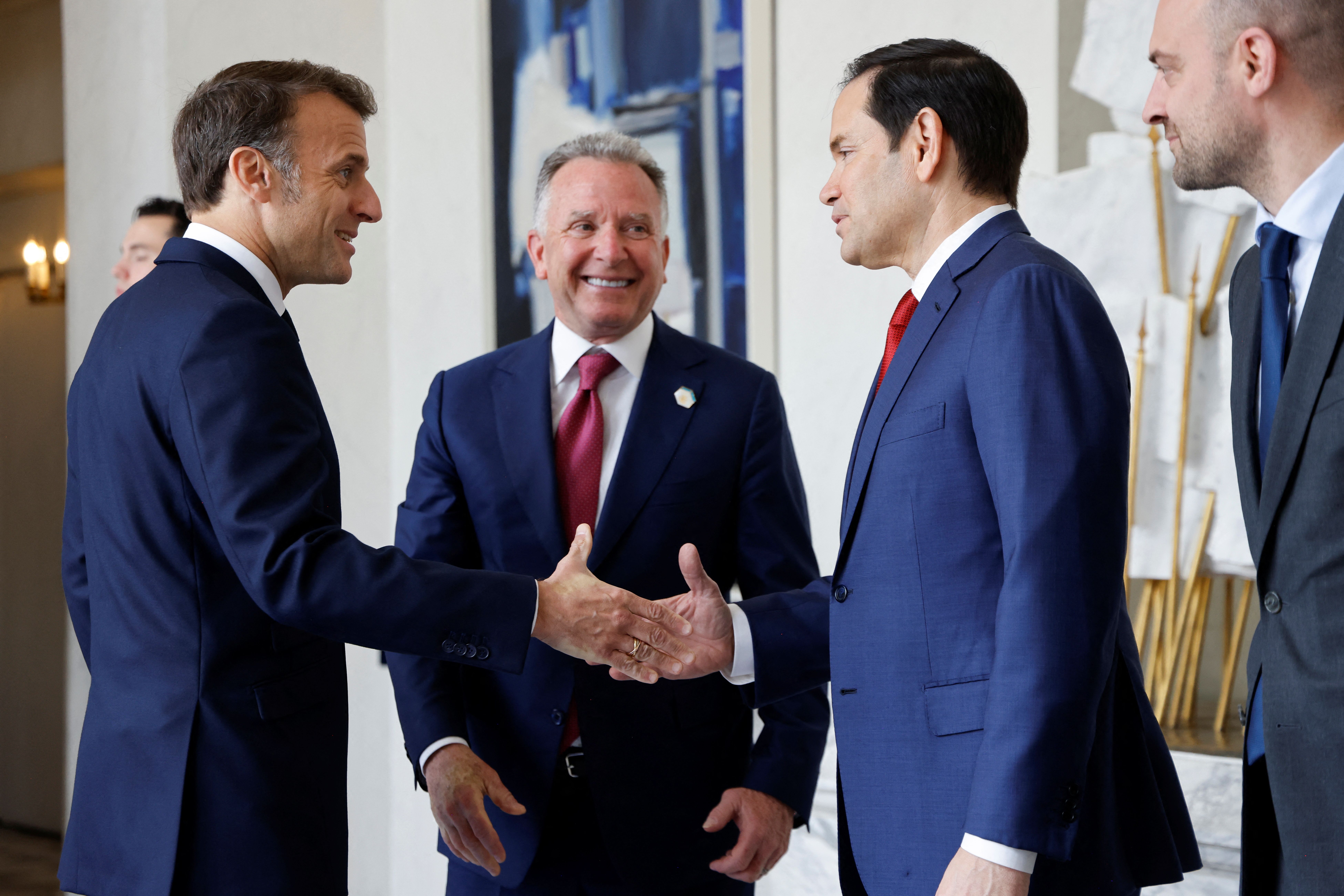 France’s President Emmanuel Macron shakes hands with US Secretary of State Marco Rubio next to US Special Envoy Steve Witkoff and France’s Minister for Europe and Foreign Affairs Jean-Noel Barrot before a meeting at the Elysee presidential palace in Paris on April 17, 2025.