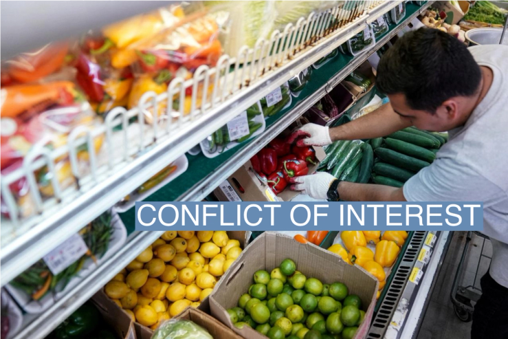 A man arranges produce at Best World Supermarket in the Mount Pleasant neighborhood of Washington, D.C.
