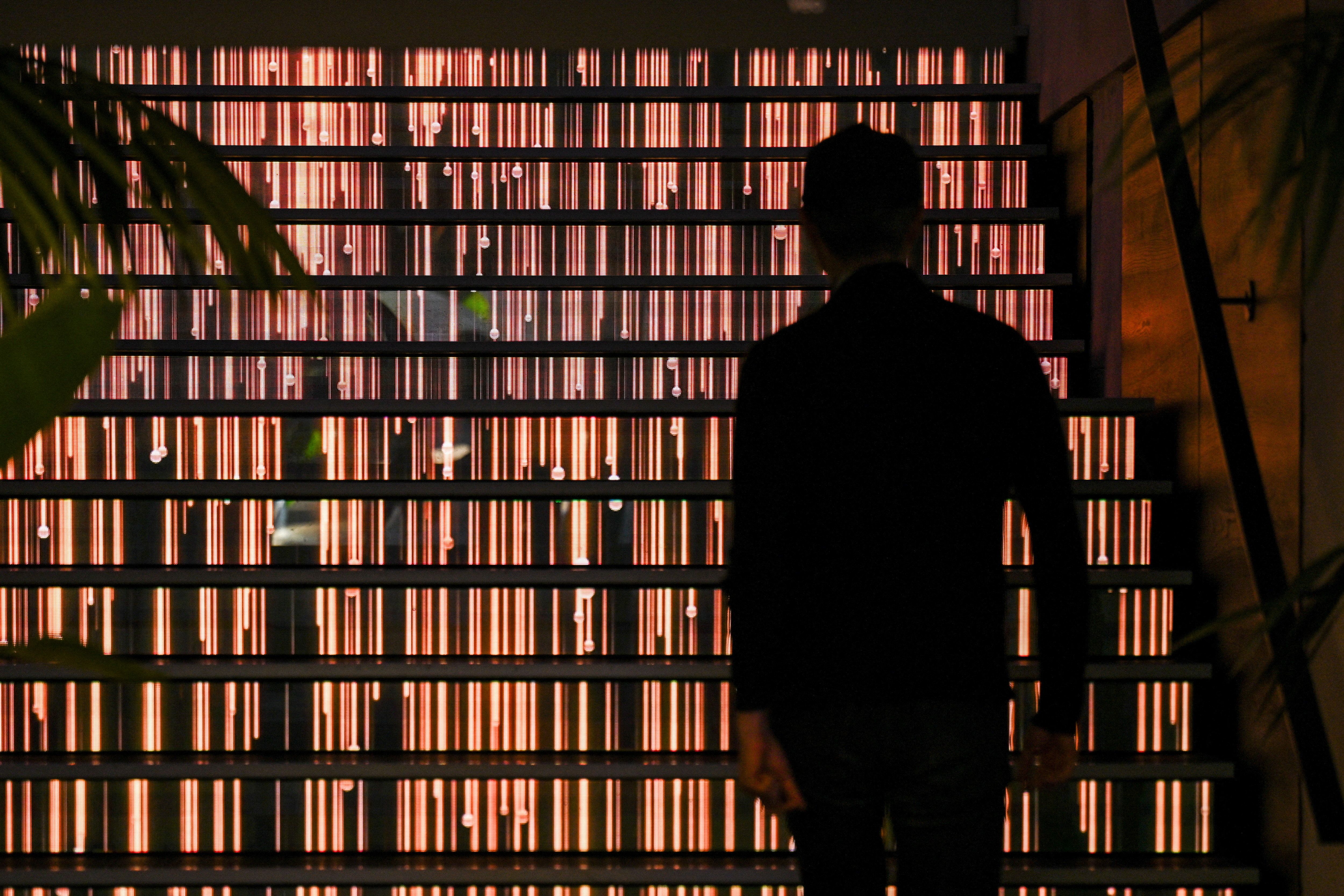 A man walks up stairs during the opening of Google’s new Artificial Intelligence (AI) centre in Berlin.