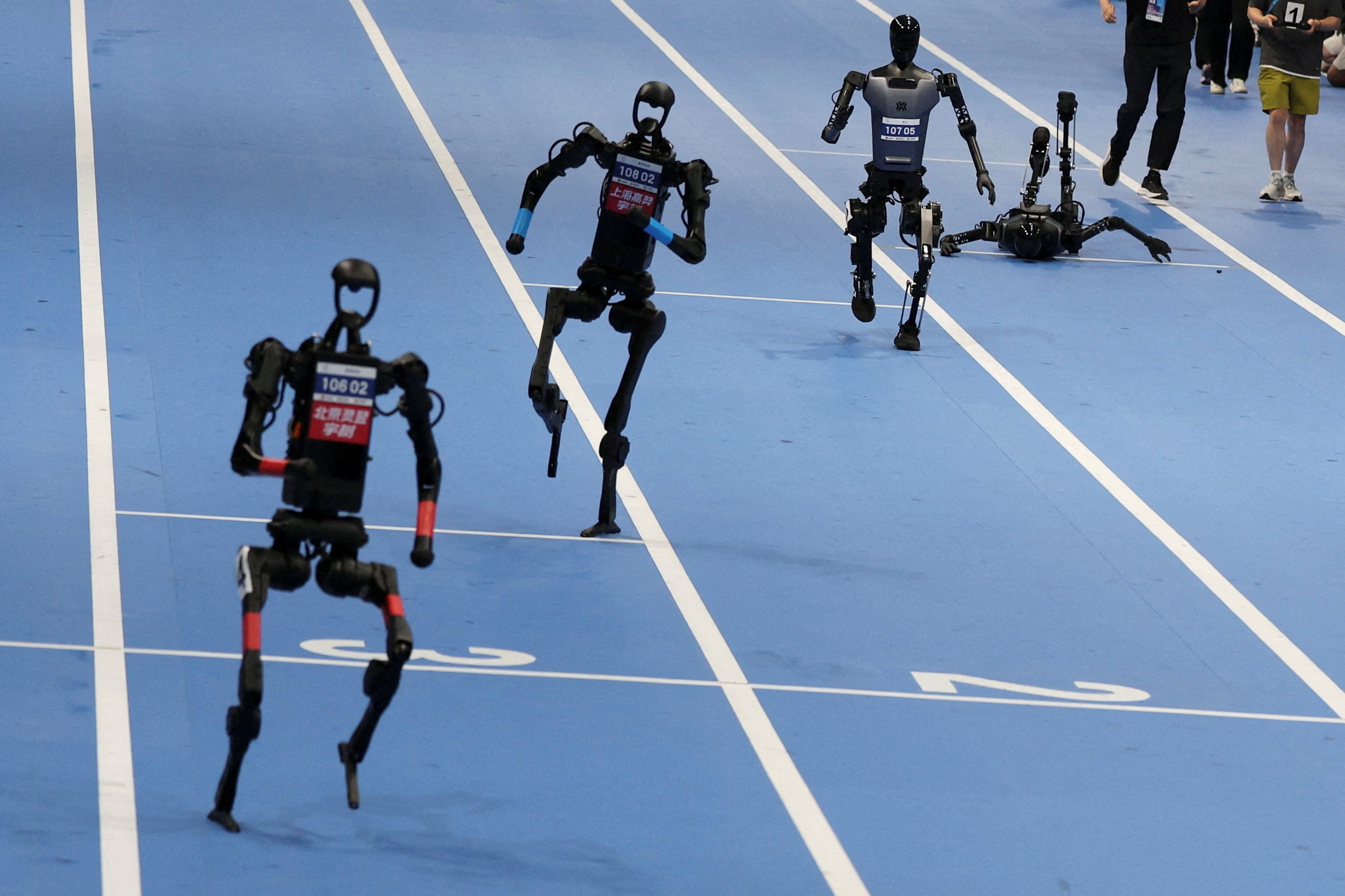 Unitree Robotics and Tiangong humanoid robots compete in the 100m final at the inaugural World Humanoid Robot Games.