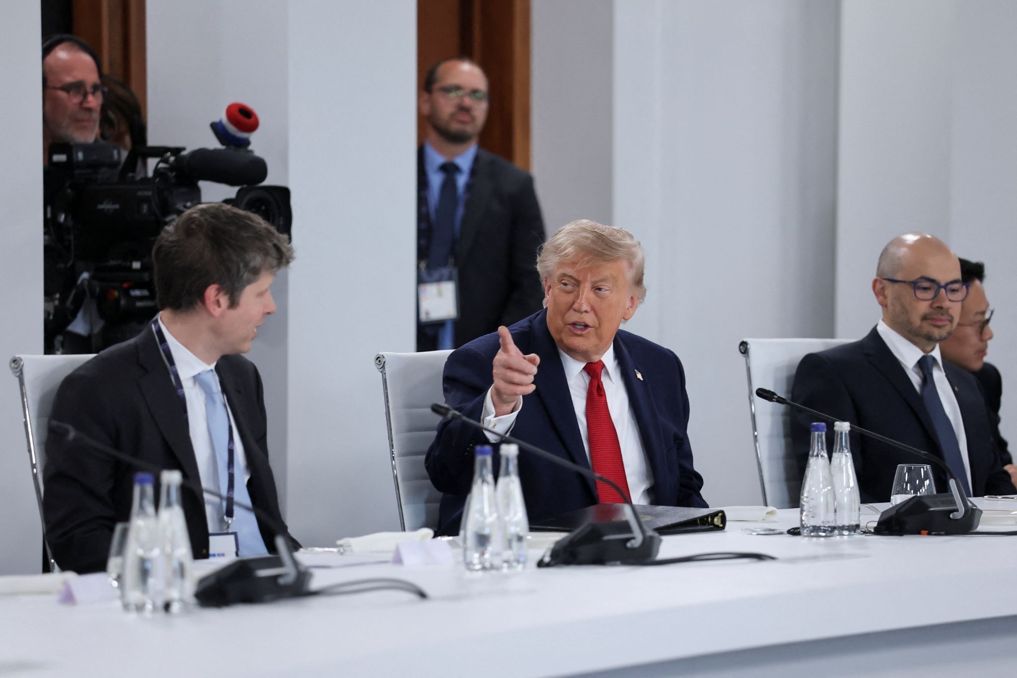 U.S. President Donald Trump speaks with the CEO of OpenAI, Sam Altman. 