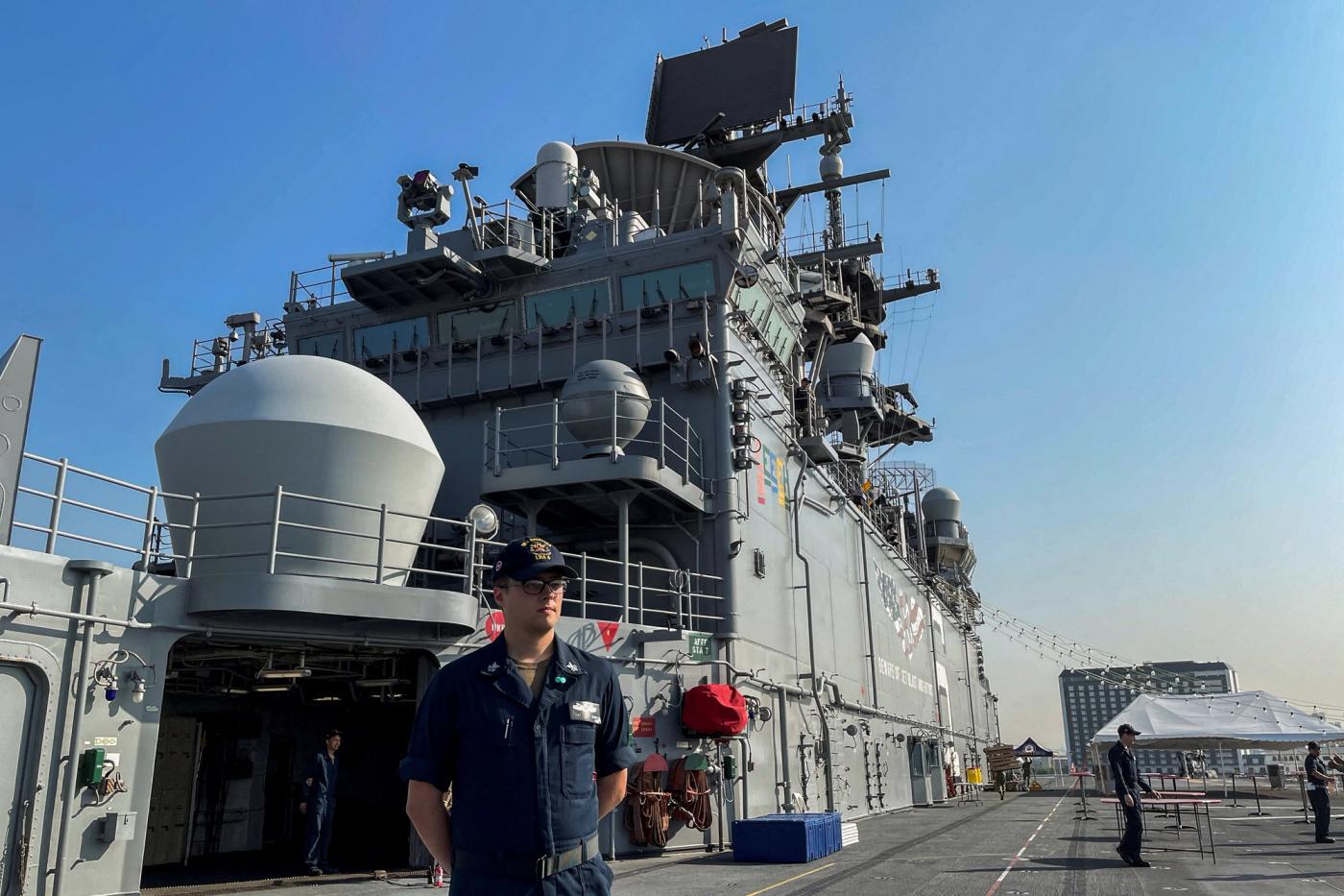 A sailor stands on the deck of the USS America (LHA-6) amphibious assault ship docked at a port in Manila, Philippines, March 21, 2023. REUTERS/Adrian Portugal
