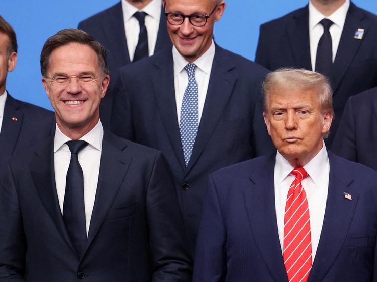 NATO leaders pose for a group photo at a summit in 2025