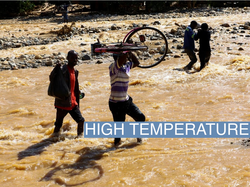 Locals cross a flooded area in Muloza on the border with Mozambique after the tropical Cyclone Freddy, around 100 km outside Blantyre, Malawi, in March 2023.