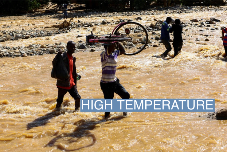 Locals cross a flooded area in Muloza on the border with Mozambique after the tropical Cyclone Freddy, around 100 km outside Blantyre, Malawi, in March 2023.