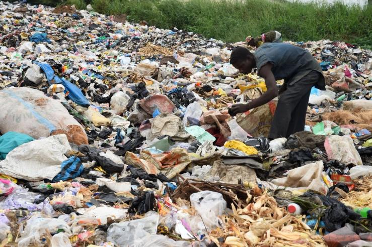 A person picks through plastic waste at a recycling center at Ibafo, southwestern Nigeria.