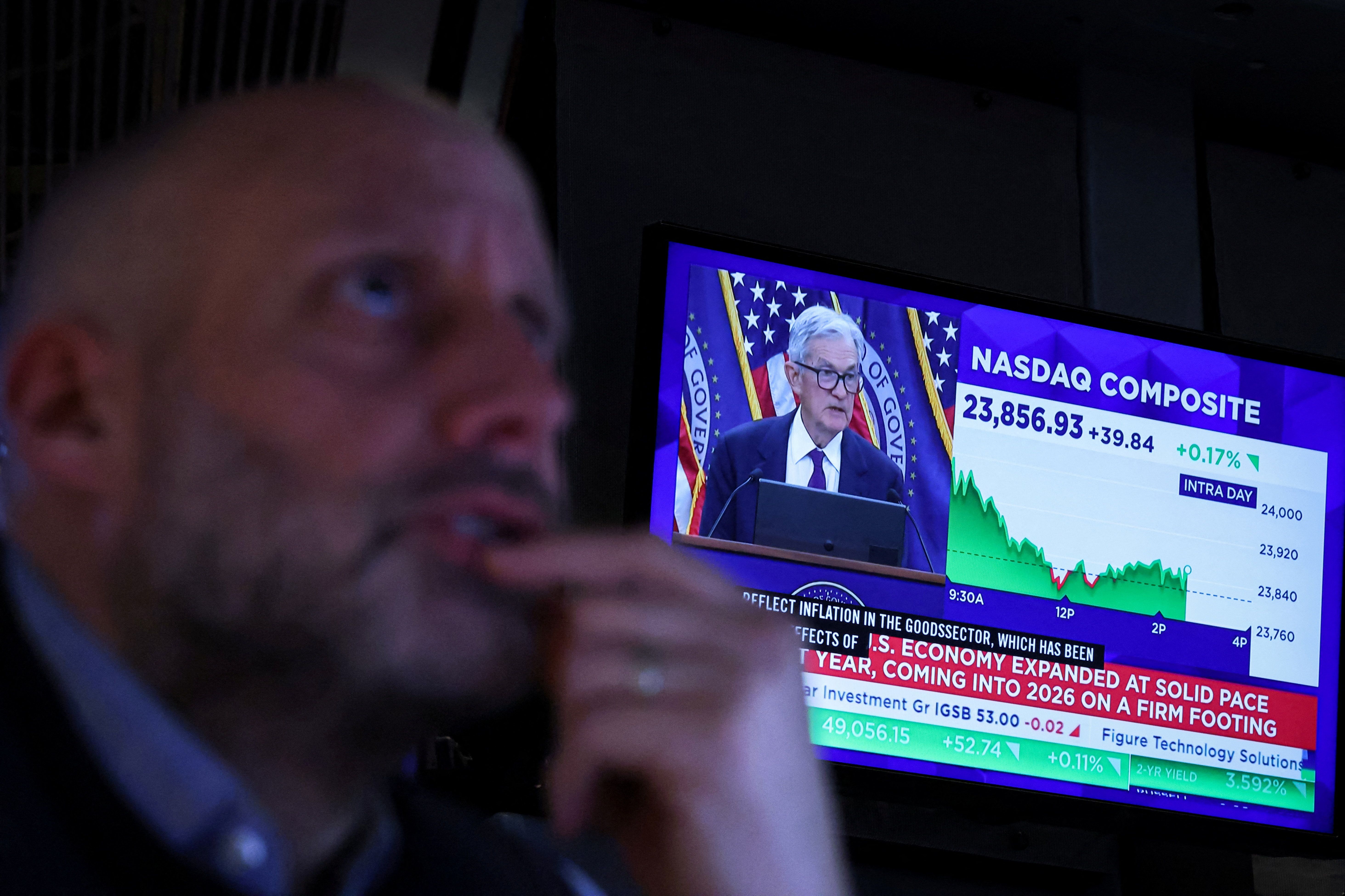 Jerome Powell speaks on a TV