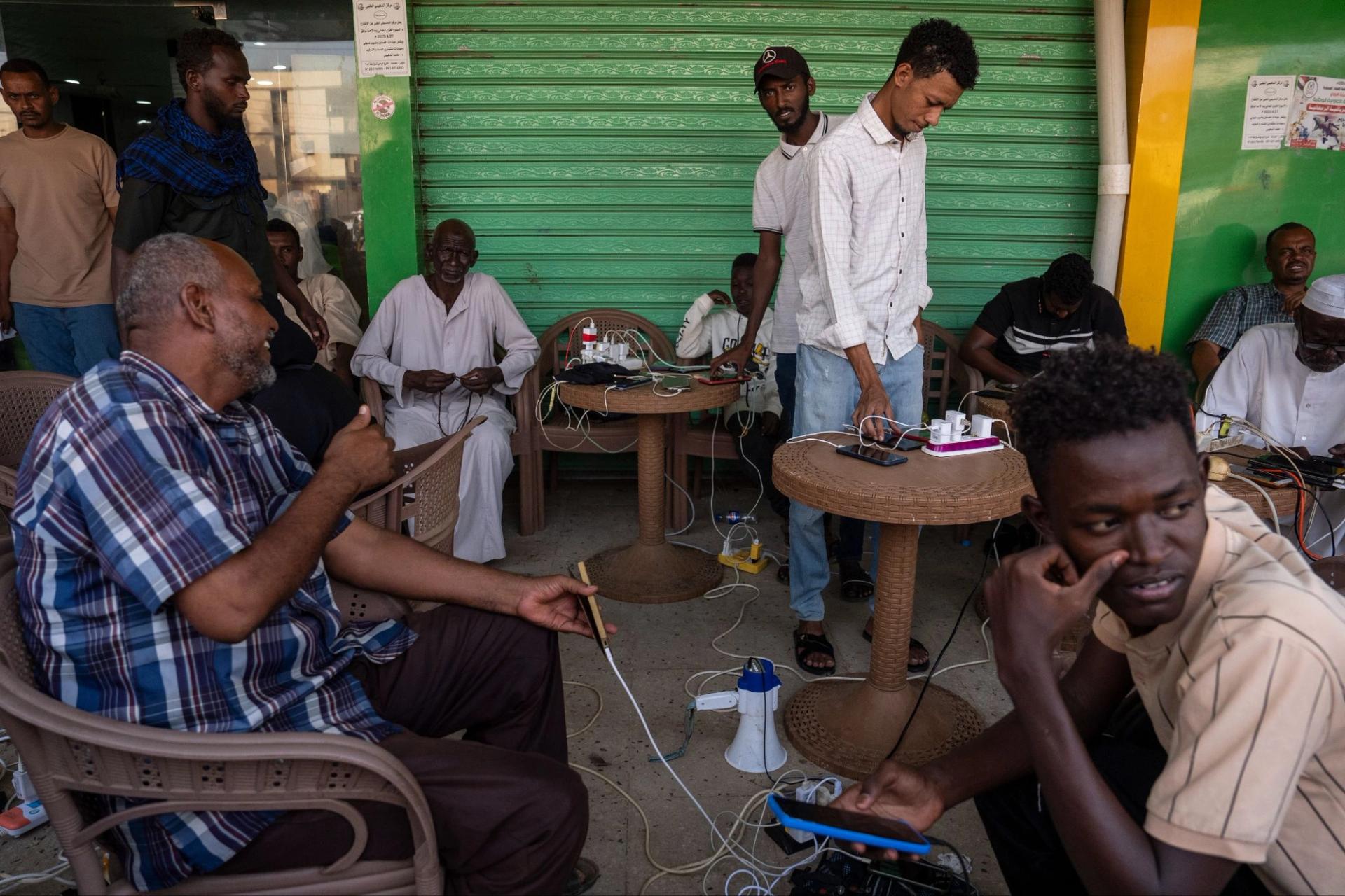 People charge their phones in Omdurman, Sudan. 