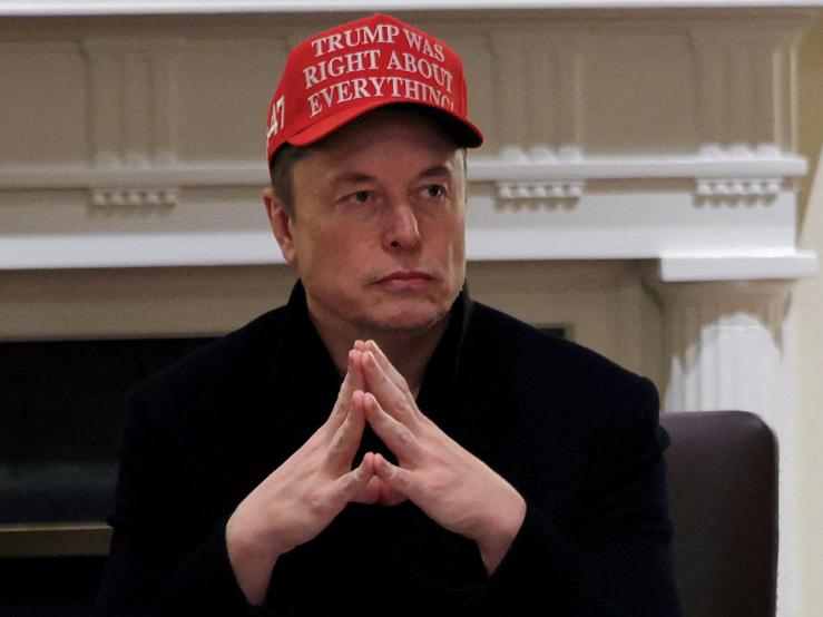 Tesla CEO Elon Musk wears a ‘Trump Was Right About Everything!’ hat while attending a cabinet meeting at the White House.