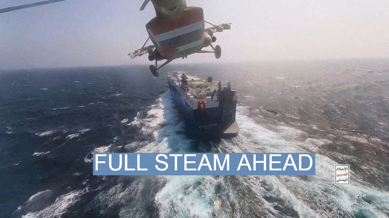 Houthi military helicopter flies over the Galaxy Leader cargo ship in the Red Sea.