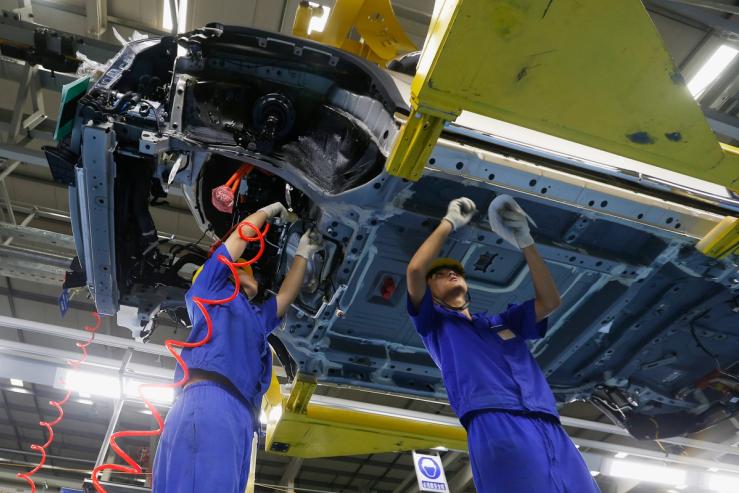 A car is being manufactured at a BYD assembly line in Shenzhen, China, 2016.