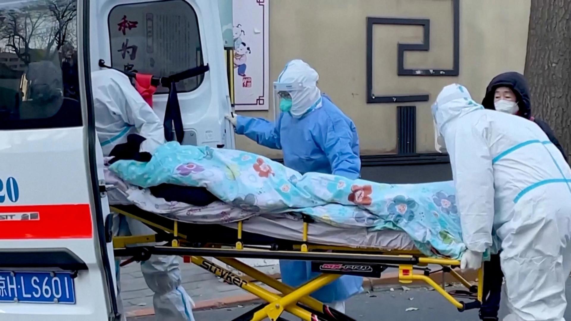 Medical staff moves a patient into a fever clinic at Chaoyang Hospital in Beijing, China.