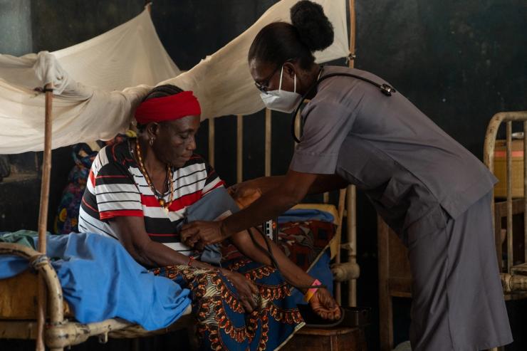 A health care worker checks a patient at the Leprosy Centre, Nassarawa, Nigeria.